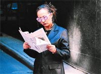 Kate studying fan mail.